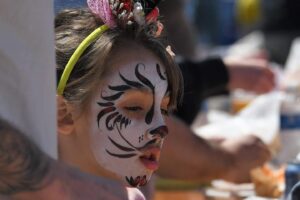 young girl with face painted